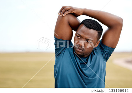 Stretching, fitness and black man in park for exercise, training and cardio workout outdoors. Sports, motivation and male person stretch arms to warm up for healthy body, wellness and performance 135166912