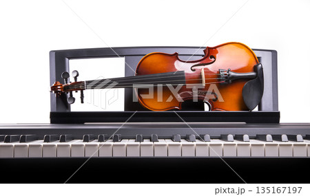Violin on the desk electronic piano 135167197