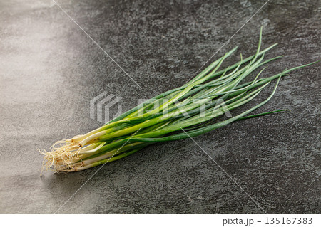 Raw young fresh green onion Raw young fresh green onion 135167383