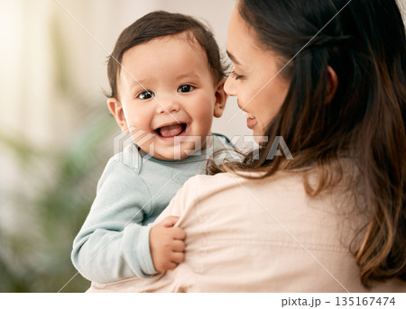 Portrait, baby and mother hug with love, smile and playing during morning bonding routine in their home together. Family, face and mom with toddler in living room having fun, embrace and relax indoor Portrait, baby and mother hug with love, smile and playing during morning bonding routine in their home together. Family, face and mom with toddler in living room having fun, embrace and relax indoor 135167474