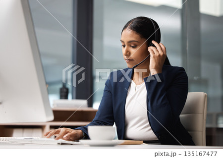 Computer, telemarketing and woman typing in call center office for customer service, help desk or technical support. Crm, contact us and female sales agent, business consultant or employee listening. 135167477