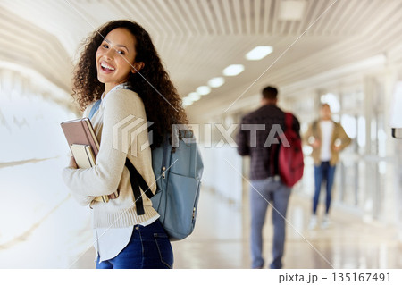 University student, books and portrait of a woman in school for education, learning and studying. Happy african person with a backpack at college or campus for knowledge and future with scholarship University student, books and portrait of a woman in school for education, learning and studying. Happy african person with a backpack at college or campus for knowledge and future with scholarship 135167491