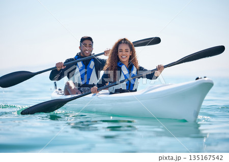 Kayak, rowing and couple on a boat at ocean, lake or river for water sports or fitness challenge. Portrait of happy man and woman with a paddle for adventure, teamwork exercise or travel in nature Kayak, rowing and couple on a boat at ocean, lake or river for water sports or fitness challenge. Portrait of happy man and woman with a paddle for adventure, teamwork exercise or travel in nature 135167542