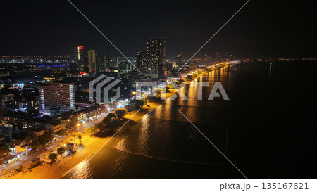 Pattaya city skyline illuminating beach and ocean at night Pattaya city skyline illuminating beach and ocean at night 135167621