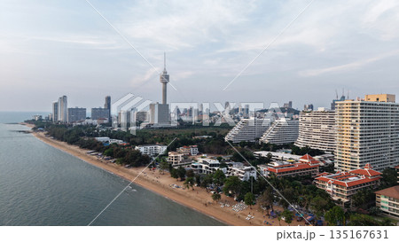 Pattaya beach and cityscape dominating the coastline at sunset Pattaya beach and cityscape dominating the coastline at sunset 135167631
