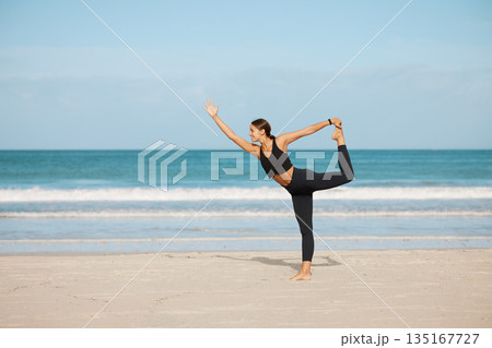 Stretching, woman and yoga on the beach for exercise, fitness or wellness workout for healthy, holistic or zen mindset. Girl, stretch and meditation at ocean, sea or outdoor pilates training Stretching, woman and yoga on the beach for exercise, fitness or wellness workout for healthy, holistic or zen mindset. Girl, stretch and meditation at ocean, sea or outdoor pilates training 135167727