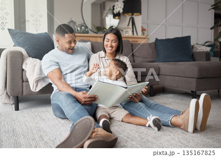 Mother, father and happy child reading books on living room floor for educational fun, learning and development at home. Family, parents and storytelling with boy kid for love, care or play in lounge 135167825