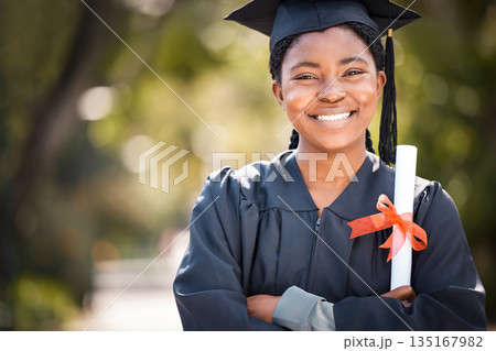 Portrait, graduation or certificate with a student black woman on university campus at a scholarship event. Education, smile or degree with a happy female pupil standing outdoor as a college graduate Portrait, graduation or certificate with a student black woman on university campus at a scholarship event. Education, smile or degree with a happy female pupil standing outdoor as a college graduate 135167982