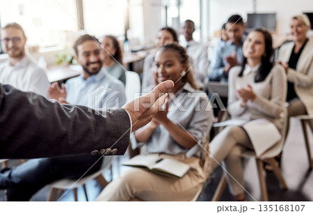 Speaker, business training or talking with hand in presentation, seminar or speaking to professional conference meeting. People, audience or group of workers at corporate tradeshow or workshop 135168107