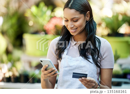 Woman phone, credit card and business owner with ecommerce, online shopping and digital payment. Outdoor, banking app and female employee with a smile with mobile connectivity on web for purchase Woman phone, credit card and business owner with ecommerce, online shopping and digital payment. Outdoor, banking app and female employee with a smile with mobile connectivity on web for purchase 135168161
