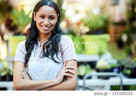 Arms crossed, pride and portrait of woman in a garden or nursery as a business owner or employee. Smile, plant expert and a worker at an ecology shop in a park with mockup space for retail or service Arms crossed, pride and portrait of woman in a garden or nursery as a business owner or employee. Smile, plant expert and a worker at an ecology shop in a park with mockup space for retail or service 135168181