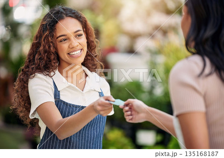 Woman waiter, credit card and payment at a coffee shop with barista and smile outdoor. Purchase, working and shopping with customer service and a female retail worker with happiness from cafe pay Woman waiter, credit card and payment at a coffee shop with barista and smile outdoor. Purchase, working and shopping with customer service and a female retail worker with happiness from cafe pay 135168187