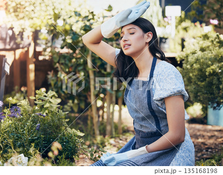Florist, tired and woman working in garden, fatigue and exhausted outdoor at work. Plants, gardening and female person with headache, stress or crisis, problem and depression, pain or sick in nature 135168198