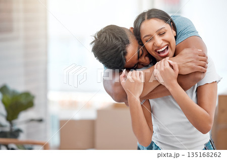 Hug, love and couple laugh in new home excited for property, apartment and real estate investment, Relationship, house and man and woman embrace, laughing and happy in living room on moving day Hug, love and couple laugh in new home excited for property, apartment and real estate investment, Relationship, house and man and woman embrace, laughing and happy in living room on moving day 135168262