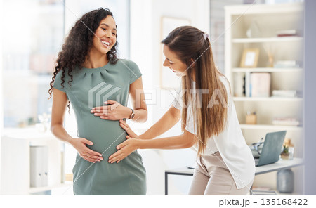 Happy, woman visit her pregnant friend and in a office of their modern workplace with a lens flare. Baby care or healthcare wellness, happiness and friends together at workstation with stomach growth 135168422