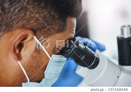 Science, laboratory and man looking in microscope for research, medical analysis and lab test. Healthcare, biotechnology and male scientist with equipment for virus sample, experiment and examine Science, laboratory and man looking in microscope for research, medical analysis and lab test. Healthcare, biotechnology and male scientist with equipment for virus sample, experiment and examine 135168448