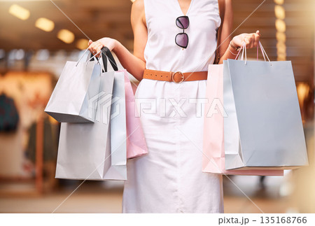Fashion, mall and woman with shopping bag in hands for a sale or discount deal. Female person or customer advertising retail bags for promotion offer, luxury designer product and store credit or gift 135168766