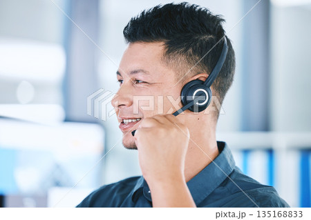 Call center, face and a man talking on a microphone for contact us or customer service communication. Crm, telemarketing and sales or happy technical support agent or consultant person with a headset Call center, face and a man talking on a microphone for contact us or customer service communication. Crm, telemarketing and sales or happy technical support agent or consultant person with a headset 135168833