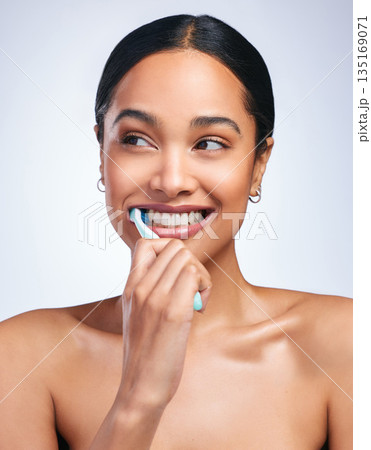 Woman, brushing teeth and studio with thinking, smile or self care for dental wellness, health or white background. Girl, dentistry model and toothbrush with toothpaste, product or happy for cleaning Woman, brushing teeth and studio with thinking, smile or self care for dental wellness, health or white background. Girl, dentistry model and toothbrush with toothpaste, product or happy for cleaning 135169071