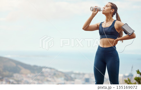 Fitness, relax, woman with drinking water and hiking in nature mockup for health and wellness during exercise. Music, bottle and fit girl on hike in park with phone, earphones and radio or podcast. Fitness, relax, woman with drinking water and hiking in nature mockup for health and wellness during exercise. Music, bottle and fit girl on hike in park with phone, earphones and radio or podcast. 135169072