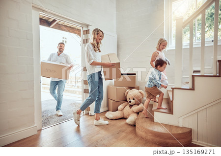 Children, new home or parents moving boxes in real estate property investment or rental apartment. Mother helping, father or happy kids carrying or lifting a box in family house to move in together 135169271