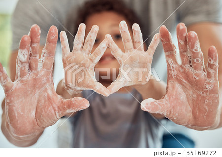Hands, soap and man with child washing palm for hygiene and bacteria protection with bubbles in a bathroom. Healthcare, parent and kid cleaning hand with foam for safety from germs or virus Hands, soap and man with child washing palm for hygiene and bacteria protection with bubbles in a bathroom. Healthcare, parent and kid cleaning hand with foam for safety from germs or virus 135169272