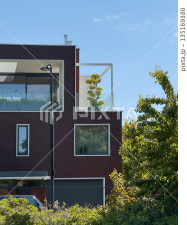 Modern urban architecture with balcony plants. Contemporary building facades and geometric design, Modern urban architecture with balcony plants. Contemporary building facades and geometric design, 135169380