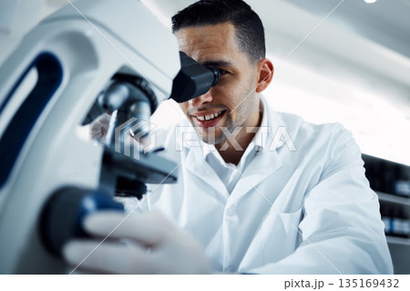 Science, research and man with microscope in laboratory for medical analysis, innovation and dna test. Healthcare, biotechnology and male scientist with equipment for study, virus sample and medicine 135169432