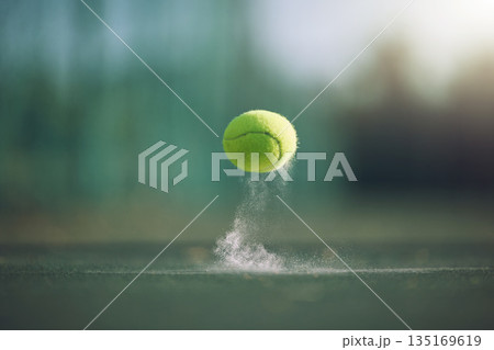 Sports, tennis and a ball bouncing on a court outdoor during a game, competition or training with chalk. Fitness, exercise and club with still life sport equipment outside for a workout or match Sports, tennis and a ball bouncing on a court outdoor during a game, competition or training with chalk. Fitness, exercise and club with still life sport equipment outside for a workout or match 135169619
