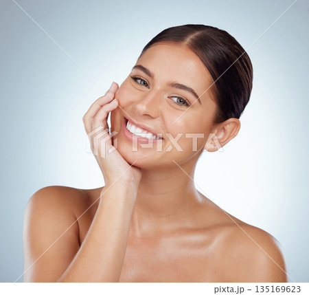 Happy face, skincare and beauty of woman in studio isolated on a white background. Portrait, natural and female model in makeup, cosmetics or facial treatment for skin health, aesthetic or wellness. 135169623