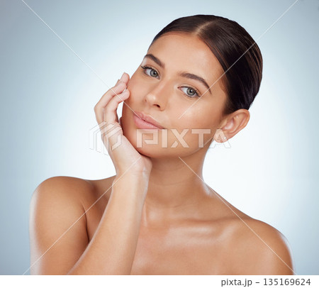 Face, skincare and beauty of confident woman in studio isolated on white background. Portrait, natural and female model in makeup, cosmetics or facial treatment for skin health, aesthetic or wellness 135169624