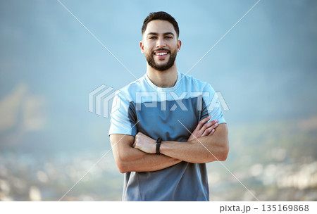 Fitness, man and outdoor for a run or workout with a smile and arms crossed for motivation. Portrait of a male athlete person in nature for cardio training, running or health and wellness goals 135169868