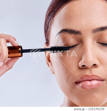 Eyelash extension, beauty or girl with mascara makeup, cosmetics or product brush for grooming in studio. Face or closeup of woman with eyelashes tool for make up or self care on white background 135170139