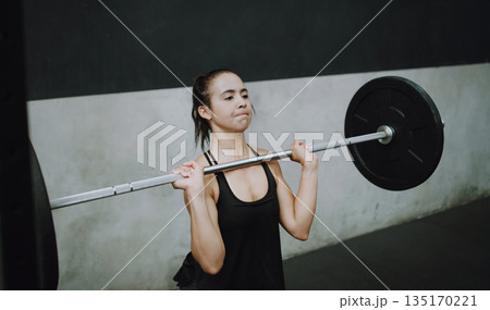 Weightlifting, fitness and woman lifting barbell in gym for training, exercise and intense workout. Deadlift, strong muscle and female body builder lift weights for challenge, wellness and strength Weightlifting, fitness and woman lifting barbell in gym for training, exercise and intense workout. Deadlift, strong muscle and female body builder lift weights for challenge, wellness and strength 135170221