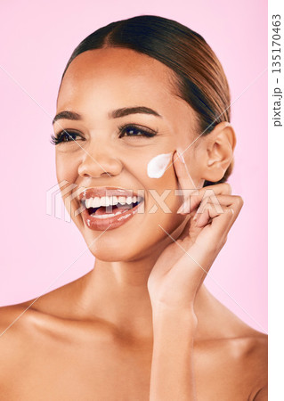 Skincare, beauty cream and face of woman in studio with cosmetics product or dermatology on pink background. Model, skin care or luxury makeup moisturizer, sunscreen or salon facial treatment Skincare, beauty cream and face of woman in studio with cosmetics product or dermatology on pink background. Model, skin care or luxury makeup moisturizer, sunscreen or salon facial treatment 135170463