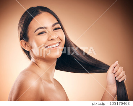 Woman, hair style and cosmetic in studio portrait for beauty, healthy shine and smile by brown background. Girl, youth model and haircare with cosmetics, hand and self care for aesthetic by backdrop 135170468