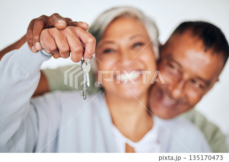 Senior couple, portrait and keys in hand with smile for new home, real estate deal or property for happy retirement. Elderly woman, man and excited face for investment in house, apartment or mortgage Senior couple, portrait and keys in hand with smile for new home, real estate deal or property for happy retirement. Elderly woman, man and excited face for investment in house, apartment or mortgage 135170473