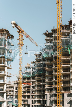 Construction of a building. Construction site with crane. Business, development, industry. Construction of a building. Construction site with crane. Business, development, industry. 135170494