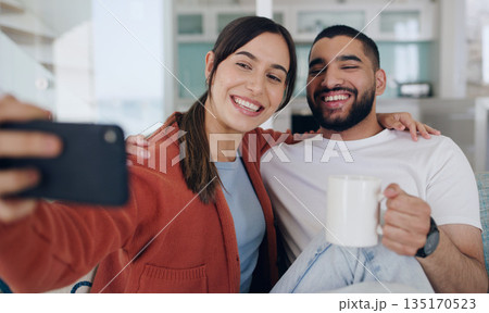Home, selfie and couple smile on sofa for social media post, online vlog and internet with coffee. Dating, morning and happy man and woman take picture for update, bonding and relax in living room Home, selfie and couple smile on sofa for social media post, online vlog and internet with coffee. Dating, morning and happy man and woman take picture for update, bonding and relax in living room 135170523