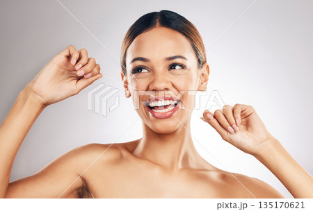 Smile, dental floss and woman in studio for mouth, teeth and wellness, hygiene or fresh breath on grey background. Flossing, happy and girl model cleaning gum, tooth and bacteria or cavity prevention 135170621