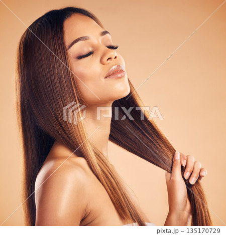 Woman, hair and beauty with hairstyle and shine, haircare and keratin treatment isolated on studio background. Female model with highlights, color and cosmetic care, texture and growth with glamour Woman, hair and beauty with hairstyle and shine, haircare and keratin treatment isolated on studio background. Female model with highlights, color and cosmetic care, texture and growth with glamour 135170729