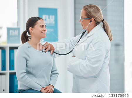 Healthcare, doctor exam with woman patient and consultation with stethoscope at a hospital. Medicine or health wellness, cardiology and surgeon medical test with a female person in a clinic building Healthcare, doctor exam with woman patient and consultation with stethoscope at a hospital. Medicine or health wellness, cardiology and surgeon medical test with a female person in a clinic building 135170946