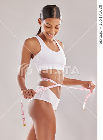 Happy woman in underwear, body and measuring tape, lose weight and health with diet isolated on studio background. Healthy lifestyle, detox and liposuction, female person check progress of weightloss Happy woman in underwear, body and measuring tape, lose weight and health with diet isolated on studio background. Healthy lifestyle, detox and liposuction, female person check progress of weightloss 135171029