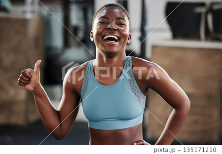Gym, portrait or happy girl with thumbs up in fitness training with positive mindset or motivation. Encouragement, workout or excited African personal trainer with like hand sign, support or thumb up Gym, portrait or happy girl with thumbs up in fitness training with positive mindset or motivation. Encouragement, workout or excited African personal trainer with like hand sign, support or thumb up 135171210