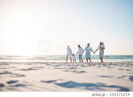 Big family, holding hands and holiday on beach with mockup space for weekend or vacation. Grandparents, parents and kids walking together on the ocean coast for fun bonding or quality time in nature 135171214