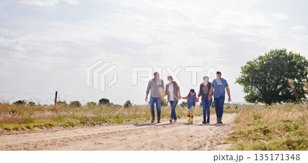 Love, happy family walking holding hands and on a farm with blue sky. Support or care, happiness or agriculture and people walk outdoors by countryside or rural environment together with generation Love, happy family walking holding hands and on a farm with blue sky. Support or care, happiness or agriculture and people walk outdoors by countryside or rural environment together with generation 135171348