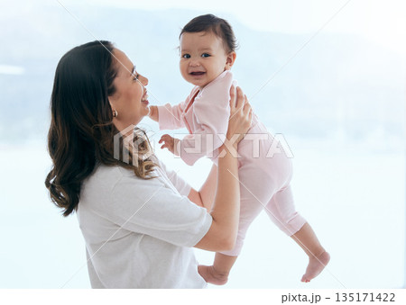 Baby laugh, portrait and mom in a home with newborn, care and parent love together feeling happy. Face, family and young child with mother and happiness in house with mama and childcare in lounge 135171422