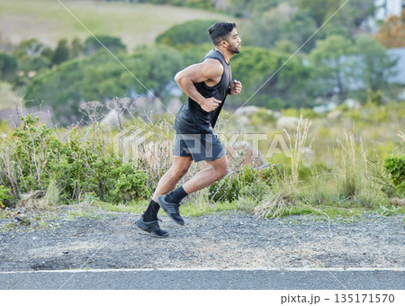 Man is running outdoor, fitness and cardio in nature with exercise and healthy, active body. Male runner on side of road, train for marathon with speed, energy and workout for health and sport Man is running outdoor, fitness and cardio in nature with exercise and healthy, active body. Male runner on side of road, train for marathon with speed, energy and workout for health and sport 135171570