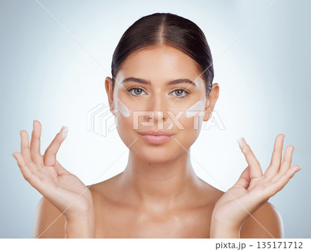 Skincare, face and beauty of woman with sunscreen in studio isolated on a white background. Portrait, dermatology cream and female model apply cosmetics, lotion or moisturizer product for skin health 135171712