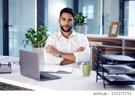 Portrait, laptop and man with arms crossed, business and employee in a modern office, serious and startup success. Face, male person and entrepreneur with a pc, career and professional in a workplace 135171751